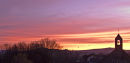 Fishguard sunrise over St. Mary's Church and Dinas Mountain